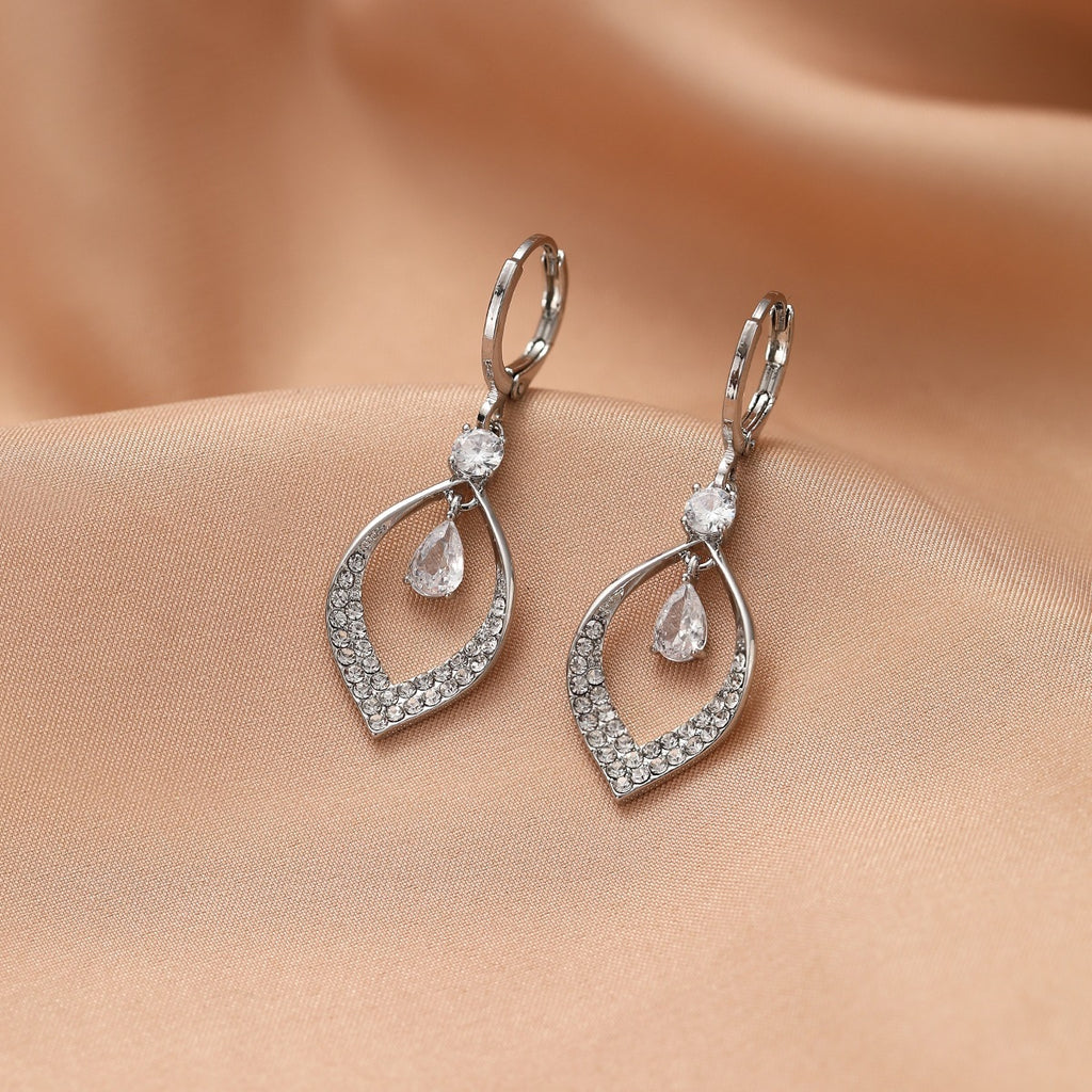 A Woman With Elegant Zircon Water Drop Tassel Earrings